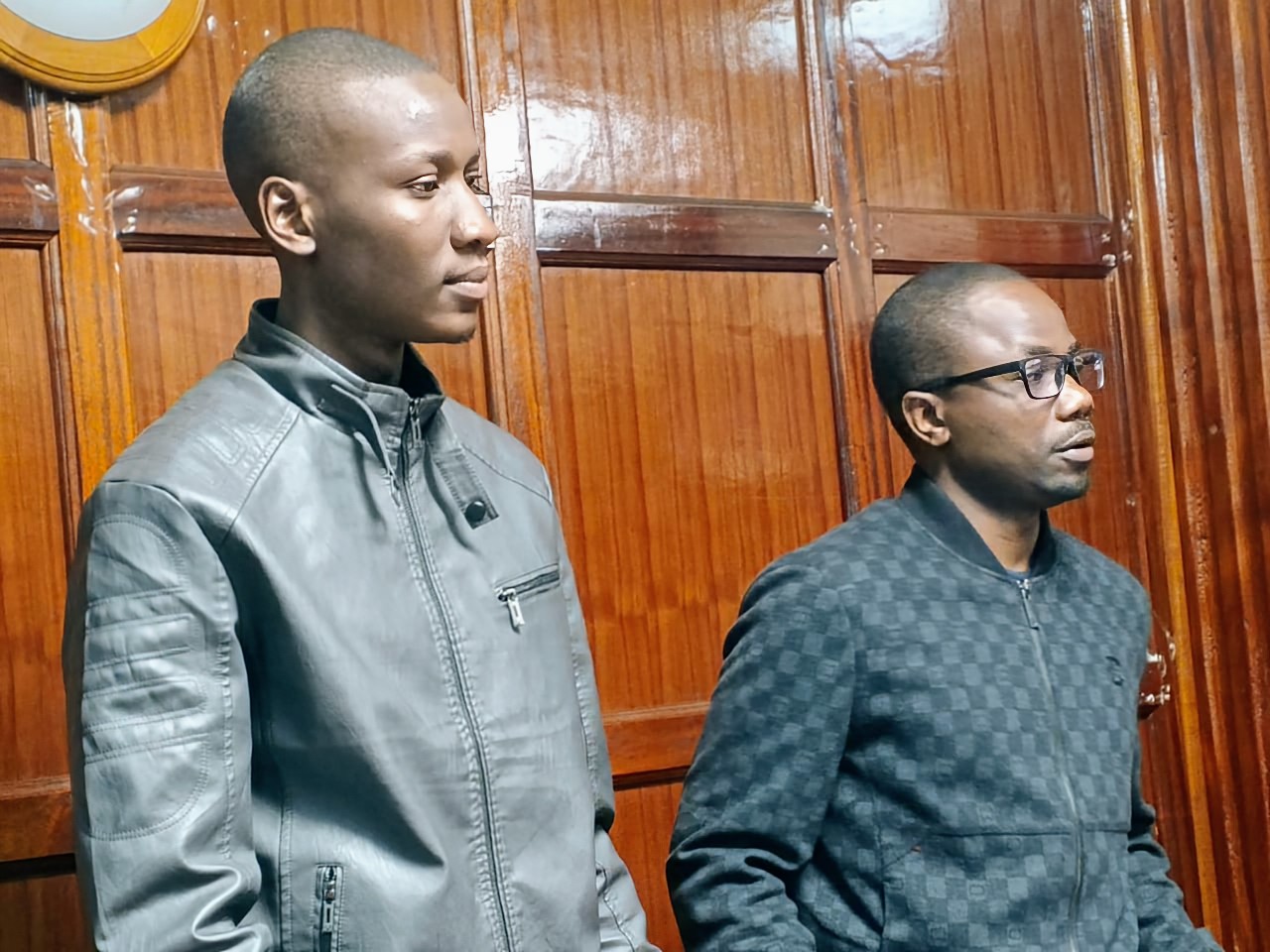 “Jackson Apollo Ananda and Alvin Oduya Atieno appear at Milimani Law Courts over Sh15 million Binance trading fraud case.”