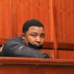 DCI officers escort suspect Robbisson Warui Mureithi to court over Sh74 million computer accessories theft investigation.
