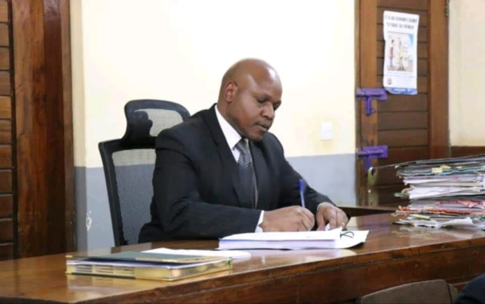 Activists outside Malindi High Court celebrating ruling stopping the Lamu coal power plant project.