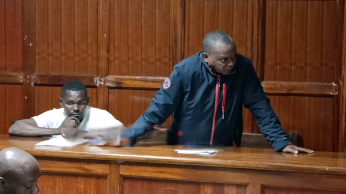 Police officers at a crime scene in Imara Daima, Nairobi
