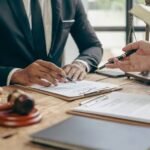 An image illustration of an attorney explaining an asbestos lawsuit to a client diagnosed with mesothelioma.