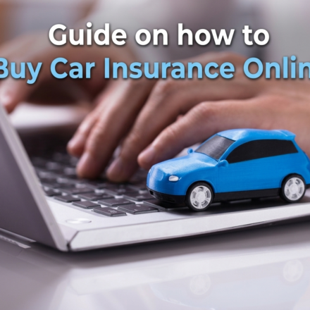 Driver using a laptop to buy car insurance online
