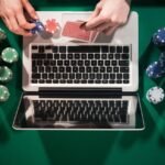 An image of a Person using a laptop to enjoy online gambling in Michigan