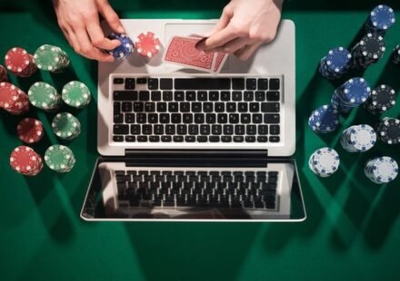 An image of a Person using a laptop to enjoy online gambling in Michigan